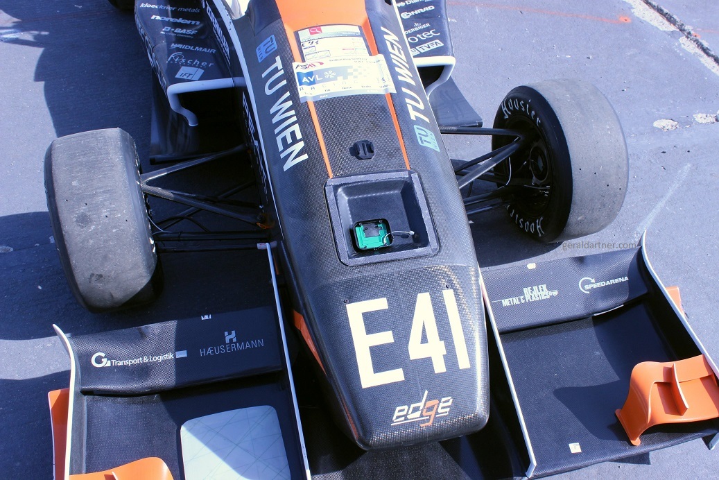 Carbon-Fiber Reinforced Antenna Cavity Hidden in the Monocoque of a Racing Car